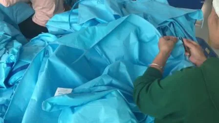 Vêtements imperméables bleus pour tout le corps vêtements de protection d'isolement stériles jetables anti-poussièreVêtements de protection de travail non stériles de sécurité